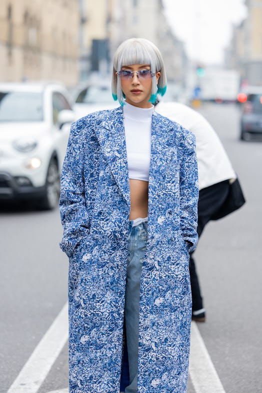 Colorful blue hair is a beauty street style trend during Milan Fashion Week Womenswear Fall/Winter 2...