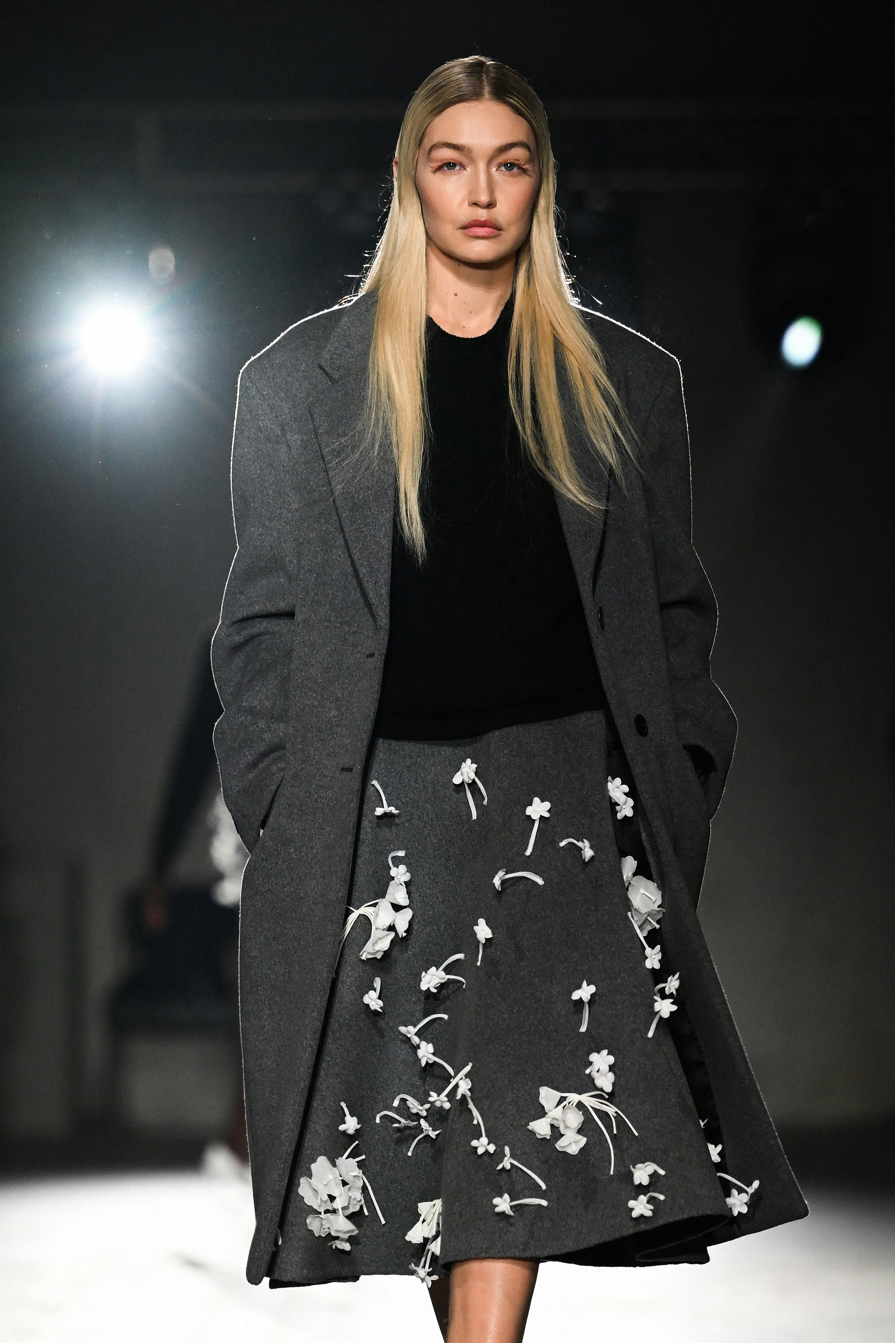 US model Gigi Hadid presents a creation for Prada on February 23, 2023 during the Fall-Winter 2023-2...