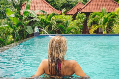 Young Colombian woman enjoying the swimming pool in Bali Indonesia