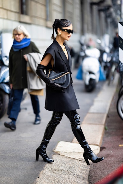 Side swept bangs are a beauty street style trend during Milan Fashion Week Womenswear Fall/Winter 20...