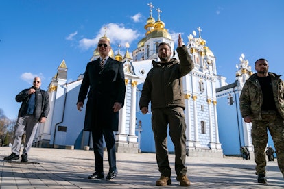 US President Joe Biden (C-L) walks with Ukrainian President Volodymyr Zelensky (C-R) at St. Michael'...