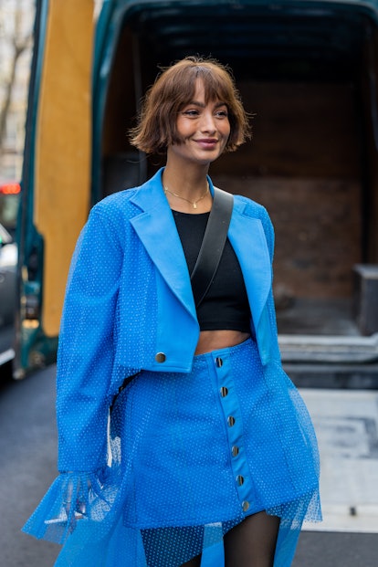Blunt bobs are a  Paris Fashion Week Fall/Winter 2023 street style beauty trend.
