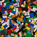 A colorful photo of a big pile of colorful Lego bricks. Recently, six scientists swallowed Lego head...