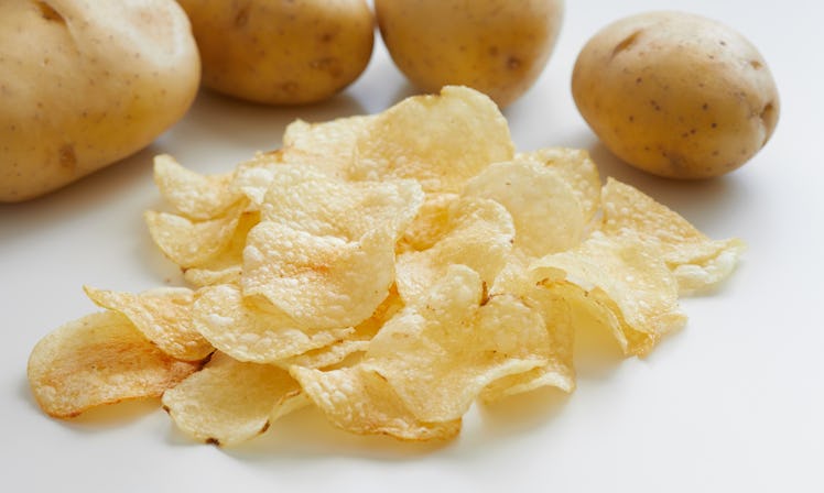 Close-up of crispy fried greasy potato chips