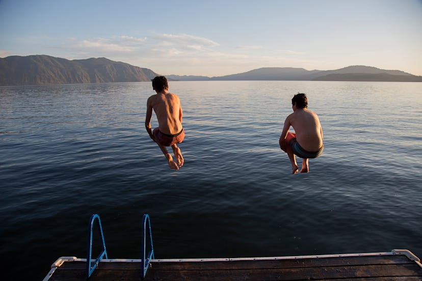 brothers jumping together into a lake, in a list of brother name pairing ideas