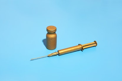 A gold syringe