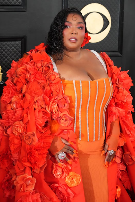 Lizzo attends the 2023 Grammys in a spicy Dolce & Gabbana number. Photo by Jeff Kravitz/FilmMagic)