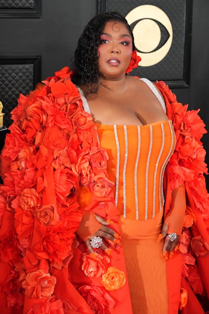 Lizzo attends the 2023 Grammys in a spicy Dolce & Gabbana number. Photo by Jeff Kravitz/FilmMagic)