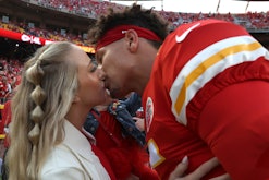 KANSAS CITY, MISSOURI - SEPTEMBER 15: Patrick Mahomes #15 of the Kansas City Chiefs kisses his wife,...