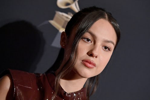 Olivia Rodrigo attends the Pre-GRAMMY Gala in a butt-slit burgundy dress