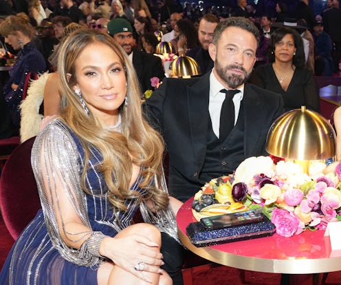Jennifer Lopez and Ben Affleck attend the 65th GRAMMY Awards and he looks... bored. Photo by Kevin M...