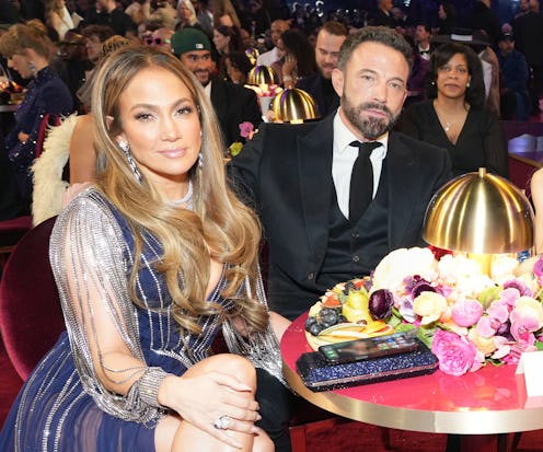 Jennifer Lopez and Ben Affleck attend the 65th GRAMMY Awards and he looks... bored. Photo by Kevin M...
