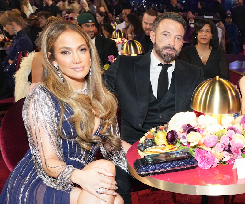 Jennifer Lopez and Ben Affleck attend the 65th GRAMMY Awards and he looks... bored. Photo by Kevin M...