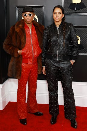 LOS ANGELES, CALIFORNIA - FEBRUARY 05: (L-R) Pharrell Williams and Helen Lasichanh attend the 65th G...