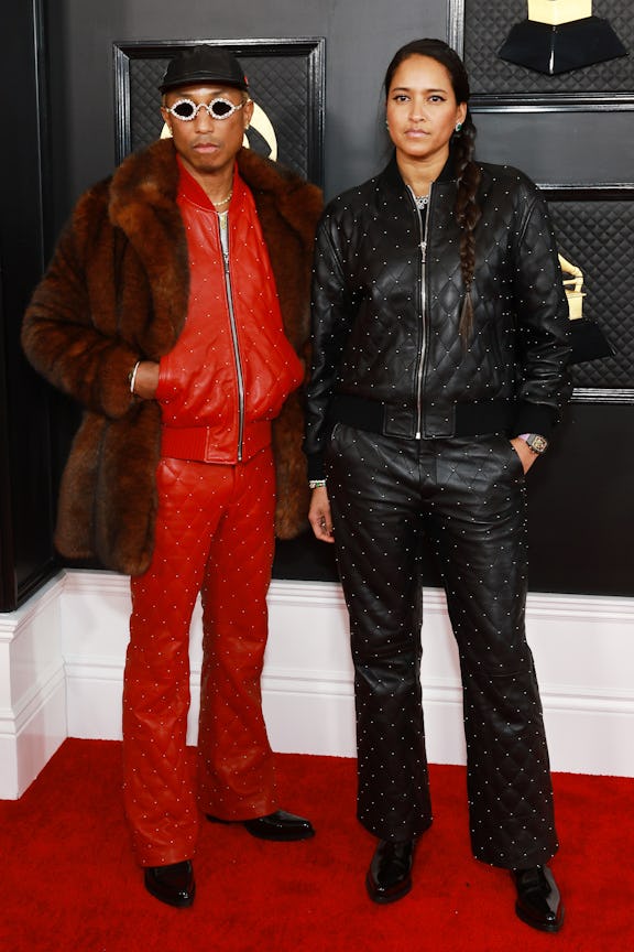 LOS ANGELES, CALIFORNIA - FEBRUARY 05: (L-R) Pharrell Williams and Helen Lasichanh attend the 65th G...