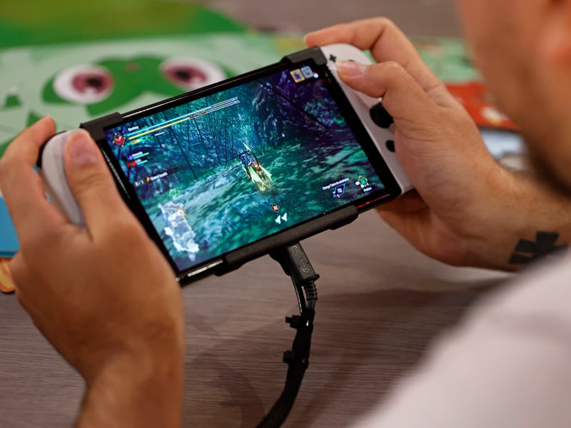 PARIS, FRANCE - NOVEMBER 03: A gamer plays a video game on a Nintendo Switch console, OLED model dur...