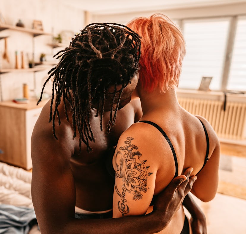 Young couple making out on bed