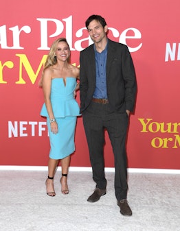 Mila Kunis joked about Ashton Kutcher and Reese Witherspoon's awkward red carpet photos.
