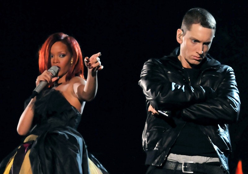 LOS ANGELES, CA - FEBRUARY 13:  Singer Rihanna (L) and rapper Eminem perform onstage during The 53rd...