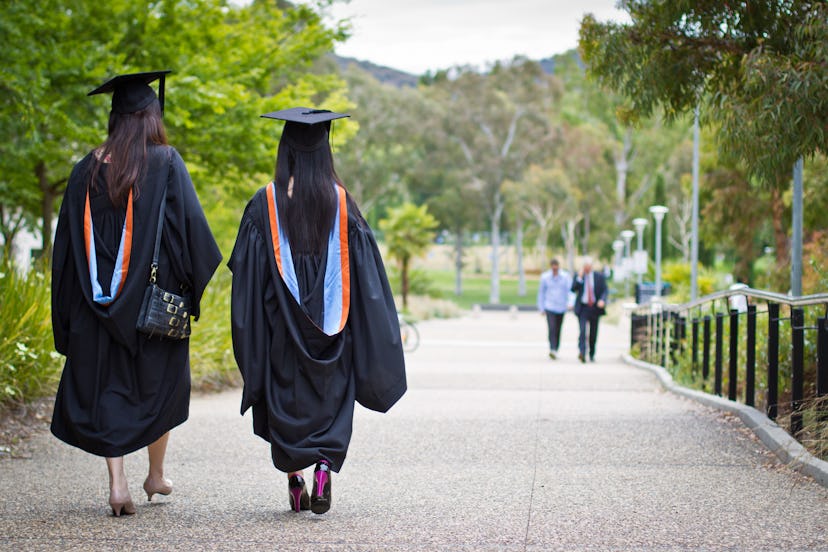 Young Chinese students that have just received their graduation diplomas from the Australian Nationa...