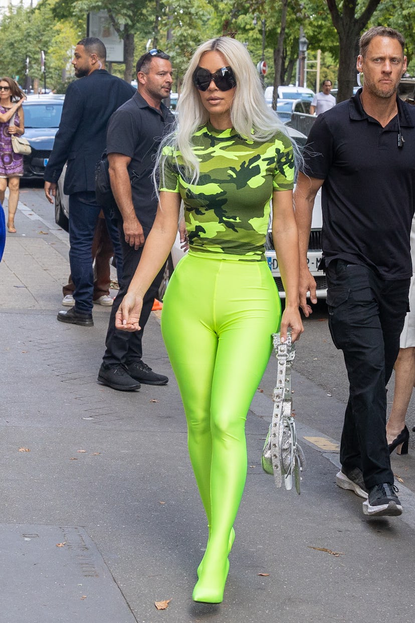 Kim Kardashian attended the Dior Homme Menswear Spring Summer 2023 in a highlighter green look.