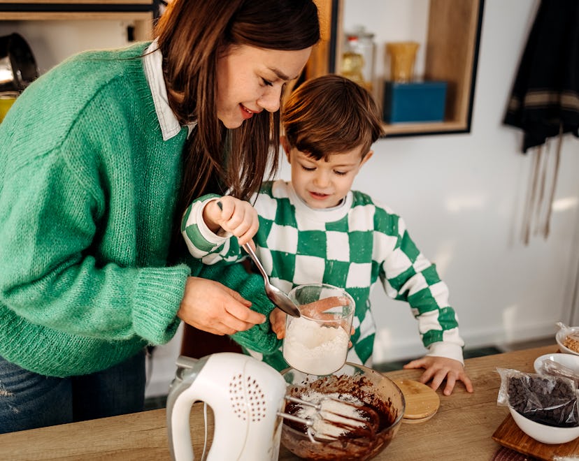 Mother and son prepare cookies together in the dining room in an article about five ingredient meal...