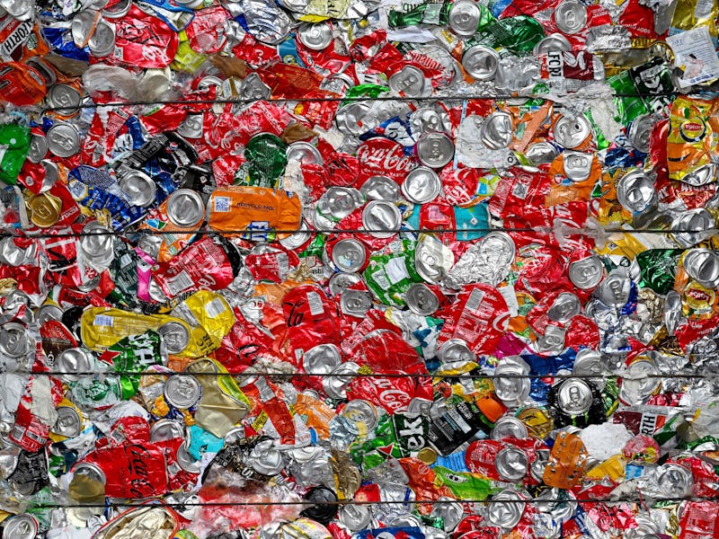 This photograph taken on October 24, 2022 shows a stack of separated aluminium cans awaits to be shi...