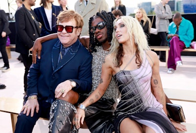 WEST HOLLYWOOD, CALIFORNIA - MARCH 09: (L-R) Elton John, Lil Nas X, and Miley Cyrus attend the Versa...