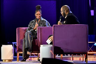 ATLANTA, GEORGIA - DECEMBER 02: Former First Lady Michelle Obama and Tyler Perry speak onstage durin...