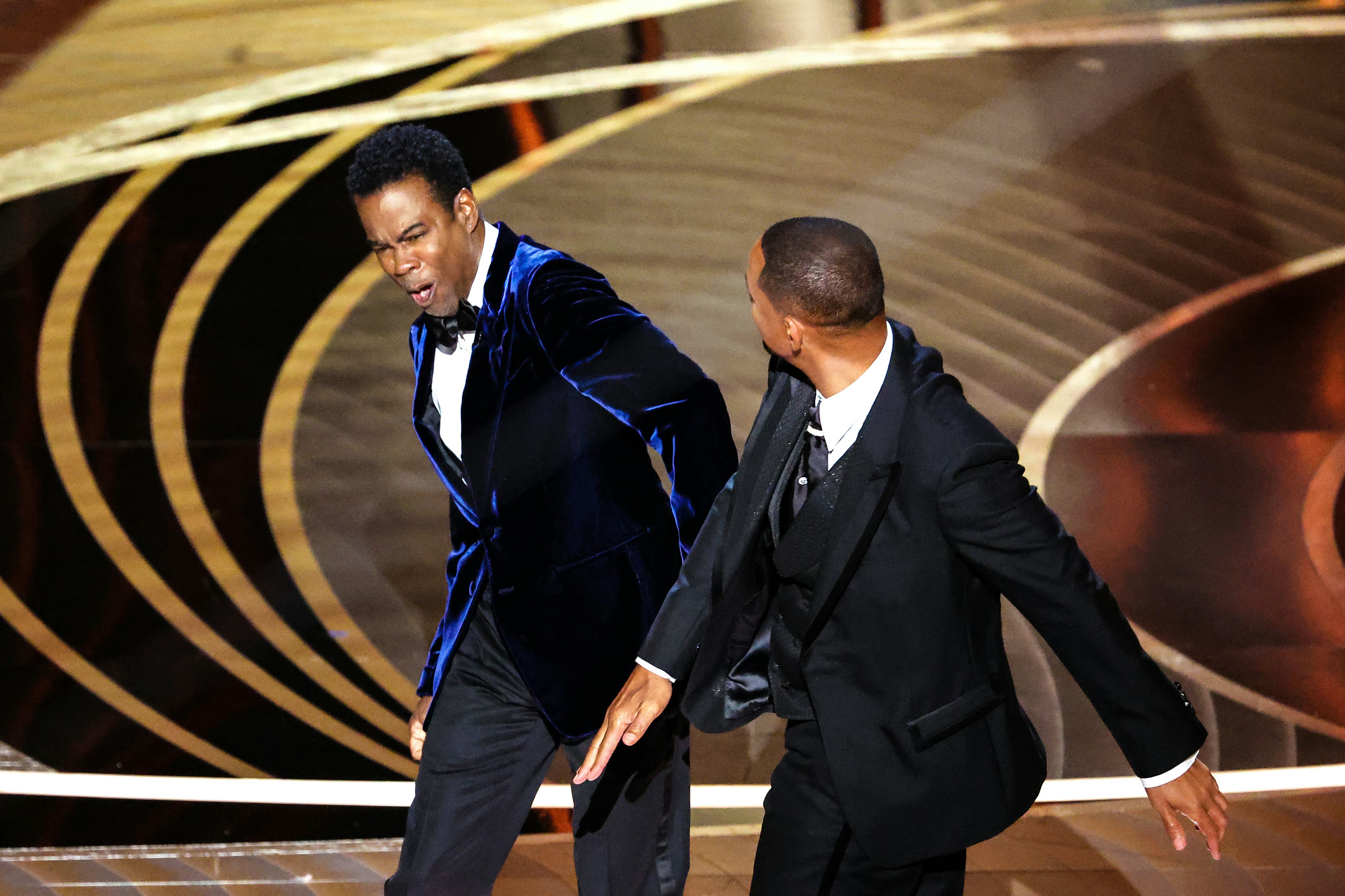 HOLLYWOOD, CA - March 27, 2022.    Will Smith slaps Chris Rock onstage during the show  at the 94th &hellip;