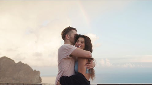 Romantic sunset on summer holidays. Heterosexual couple on a date. Embrace full of love