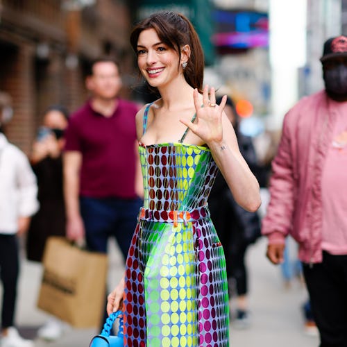 Anne Hathaway at Stephen Colbert Show in Versace on March 15, 2022