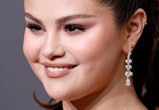 Selena Gomez posted a no-makeup selfie with her natural curly hair and tagged Miley Cyrus amid the H...