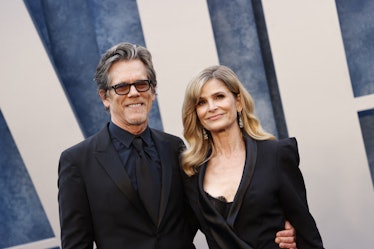 (L-R) US actors Kevin Bacon and his wife Kyra Sedgwick attend the Vanity Fair 95th Oscars Party at t...