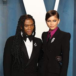 Law Roach and Zendaya attend the 2022 Vanity Fair Oscar Party in matching black suits