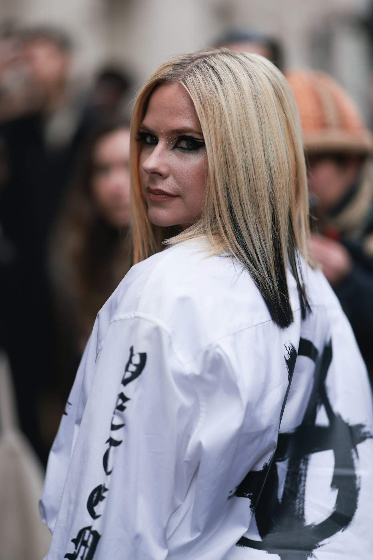 PARIS, FRANCE - MARCH 05: Avril Lavigne seen wearing a black and white jacket before the Ottolinger