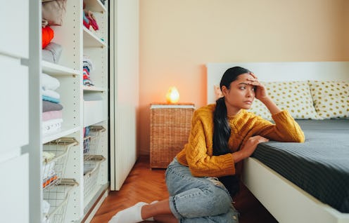 Thoughtful woman at home