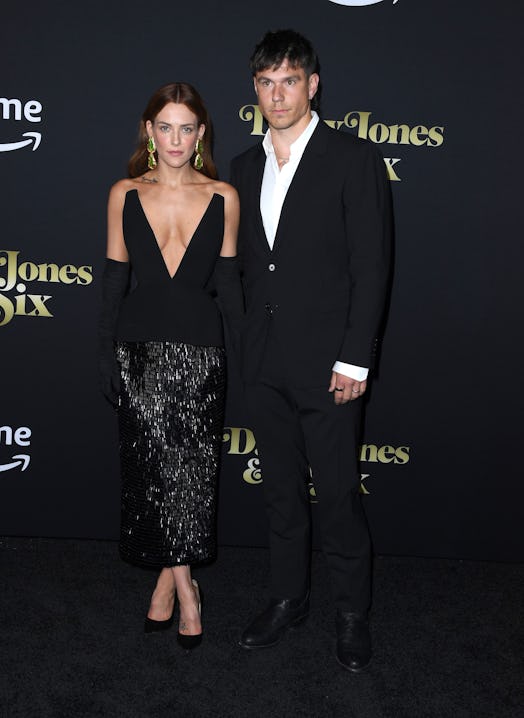 HOLLYWOOD, CALIFORNIA - FEBRUARY 23: Riley Keough and Ben Smith-Petersen arrives at the Los Angeles …