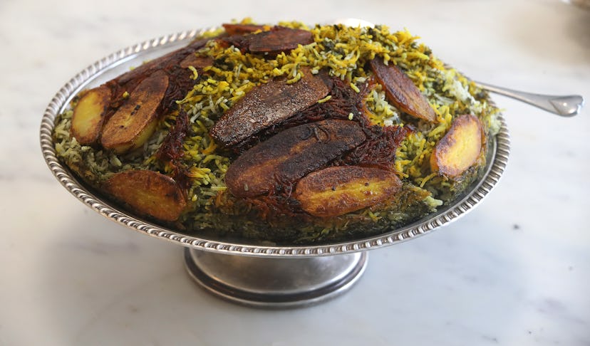 Nowruz (Persian new year) dish of sabzi polo, and herb rice dish, with fish   