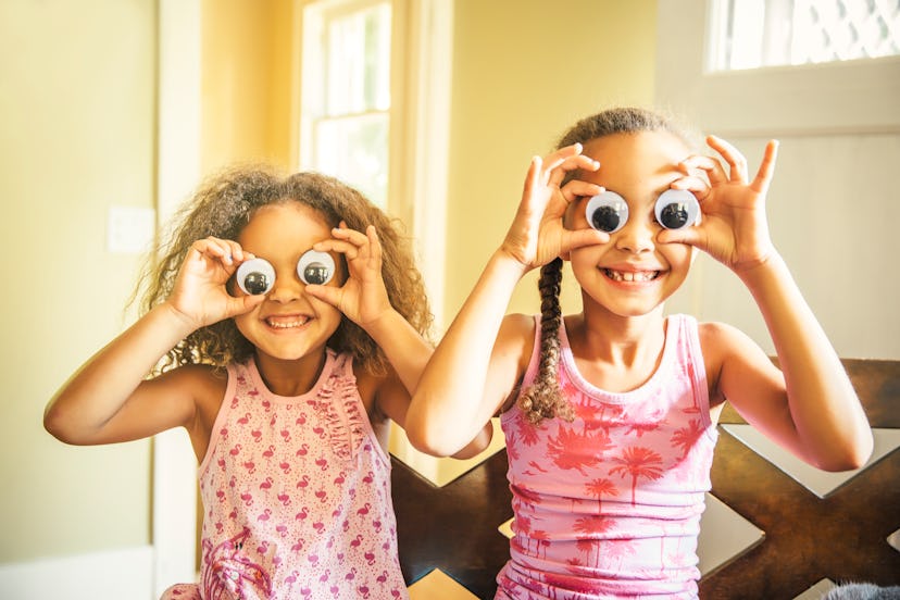 kids playing with googly eyes in a list of April Fools' pranks for grandparents
