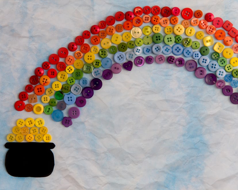 Buttons arranged on scrapbook paper to look like a leprechaun's pot of gold at the end of a rainbow ...