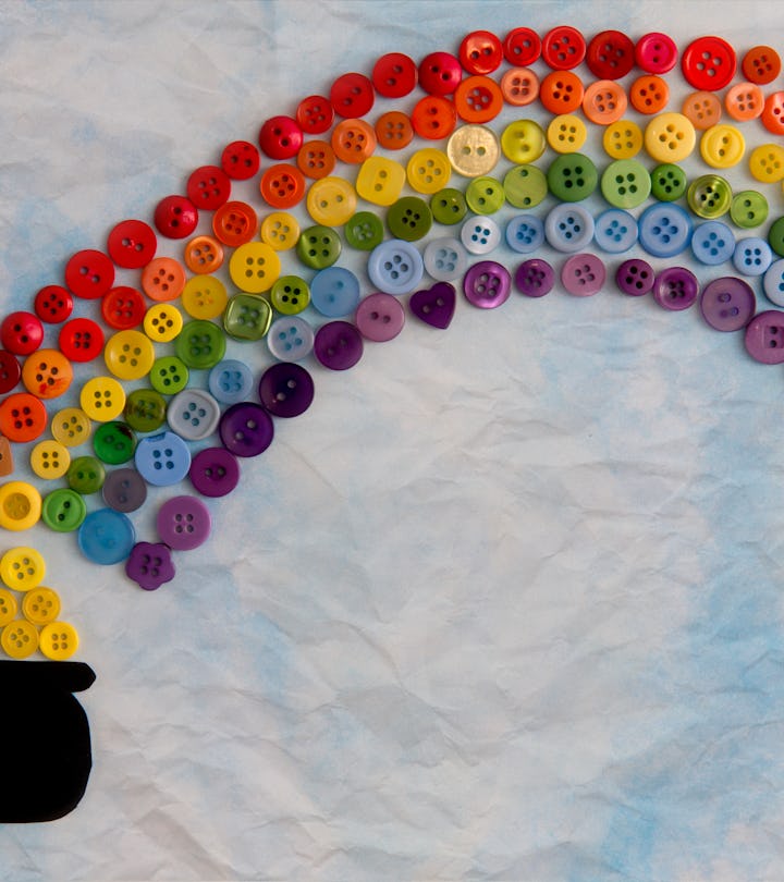 Buttons arranged on scrapbook paper to look like a leprechaun's pot of gold at the end of a rainbow ...