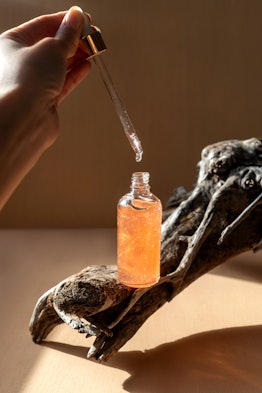 Face serum in a transparent bottle