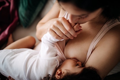 Mother breastfeeding her baby boy, in an article about how to stop breastfeeding and weaning tips
