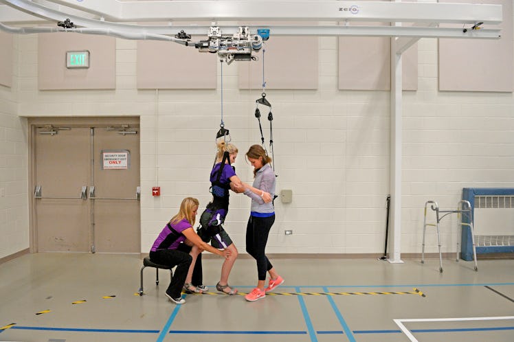 ENGLEWOOD, CO. - AUGUST 07: Mackenzie Gorden works with therapists Emma Dawson, left, and Shelby All...