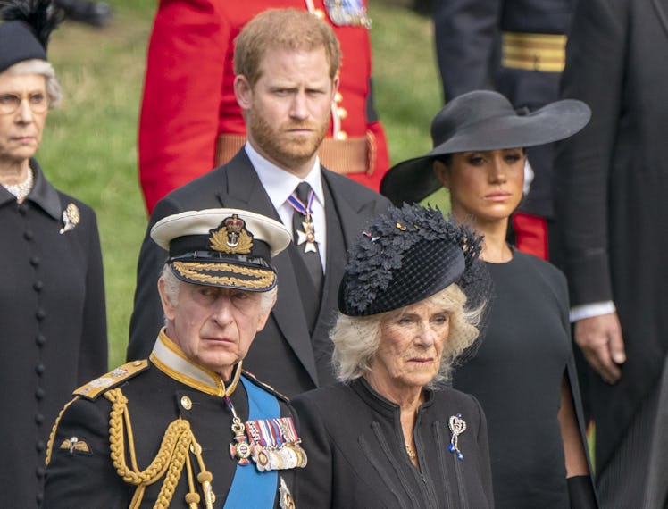 King Charles III, the Duke of Sussex, the Queen Consort, and the Duchess of Sussex look on as the St...