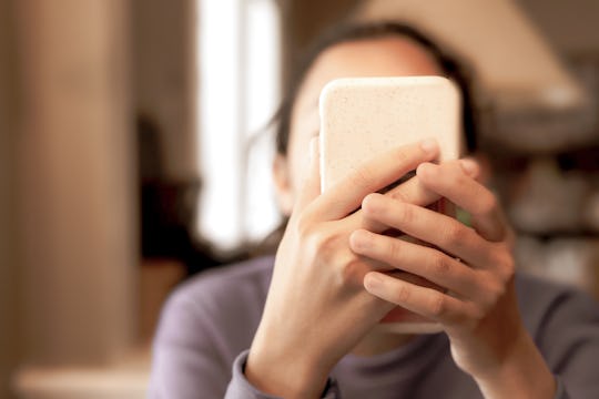 female eagerly using smart phone ~ shot with canon eos rp