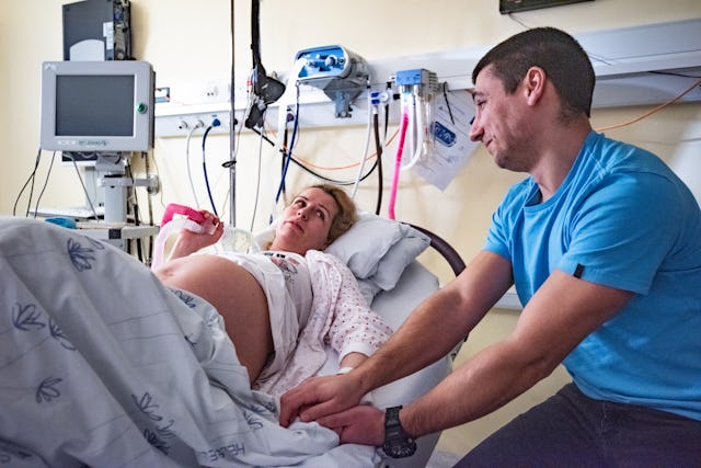 Man and pregnant women in delivery room. A mom posted a TikTok stating that she would want her husba...