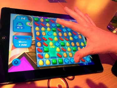 A woman plays the game Candy Crush Soda Saga on an iPad in London, Great Britian, 20 November 2014. ...