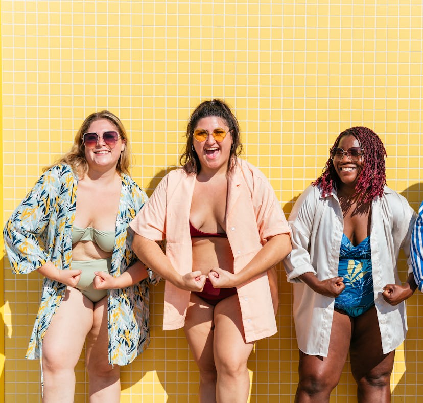 four women pose in bathing suits and strike a pose as they consider how the April 2023 full Pink Moo...